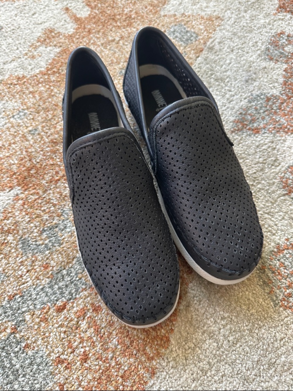 Like NEW Black Minnetonka flats